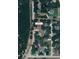 An aerial view showing the home's location, surrounded by lush greenery, close to Villa City Road at 18148 Villa City Rd, Groveland, FL 34736