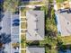 Aerial view of a residential building, parking lot, and green spaces at 10421 Manderley Way # 268, Orlando, FL 32829