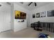 Bright bedroom with a large TV, Artemis posters and a ceiling fan at 10421 Manderley Way # 268, Orlando, FL 32829