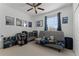 Charming bedroom featuring space-themed decor, a crib, and comfortable futon at 10421 Manderley Way # 268, Orlando, FL 32829