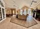 Spacious clubhouse living room with comfortable seating and elegant decor for community gatherings at 10421 Manderley Way # 268, Orlando, FL 32829