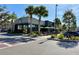 Exterior view of a Starbucks shop with outdoor seating and palm trees at 10421 Manderley Way # 268, Orlando, FL 32829
