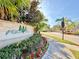 Community entrance featuring sign, beautiful landscaping, and proximity to Victoria Park at 10421 Manderley Way # 268, Orlando, FL 32829