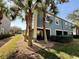 Exterior of home featuring a patio and beautiful tropical landscaping at 10421 Manderley Way # 268, Orlando, FL 32829