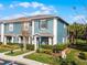 Charming two-story home with a well-maintained lawn and colorful exterior paint at 10421 Manderley Way # 268, Orlando, FL 32829