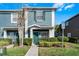 Charming two-story home with a well-maintained lawn and colorful exterior paint at 10421 Manderley Way # 268, Orlando, FL 32829
