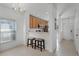 Cozy kitchen with wooden cabinets and a breakfast bar with bar stool seating at 10421 Manderley Way # 268, Orlando, FL 32829