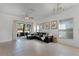 A spacious living room with tile flooring and modern décor, perfect for entertaining guests or relaxing at 10421 Manderley Way # 268, Orlando, FL 32829