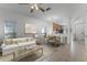 Bright open-concept living area with neutral decor and seamless flow to dining and kitchen at 10421 Manderley Way # 268, Orlando, FL 32829