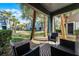 Cozy patio with black wicker chairs and landscaped views at 10421 Manderley Way # 268, Orlando, FL 32829