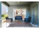Spacious outdoor patio with a rug, seating area, and sliding glass door at 10421 Manderley Way # 268, Orlando, FL 32829