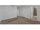 This bedroom has neutral carpeting and access to an ensuite bathroom at 12043 Holystone St, Winter Garden, FL 34787