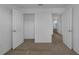 Carpeted bedroom with double door closet at 12043 Holystone St, Winter Garden, FL 34787