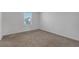 This bedroom has neutral carpeting and a window at 12043 Holystone St, Winter Garden, FL 34787