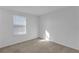 This bedroom has neutral carpeting and a window at 12043 Holystone St, Winter Garden, FL 34787