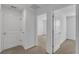 Upstairs hallway with view into adjacent bedroom at 12043 Holystone St, Winter Garden, FL 34787