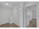 Hallway with carpet, a closet with bi-fold doors, and white doors leading to other rooms at 12043 Holystone St, Winter Garden, FL 34787