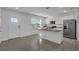 Bright kitchen with stainless steel appliances, granite countertops and an island at 12043 Holystone St, Winter Garden, FL 34787