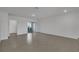 A spacious living room with neutral paint, tile floors, and a sliding glass door at 12043 Holystone St, Winter Garden, FL 34787