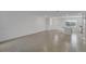 Bright, open-concept living room with tile flooring and natural light from the front windows at 12043 Holystone St, Winter Garden, FL 34787