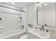 Updated bathroom with tub and shower, white vanity, and modern fixtures at 1245 13Th St, Orange City, FL 32763