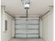 Garage door and overhead opener mechanism installed in a clean, white garage at 1245 13Th St, Orange City, FL 32763