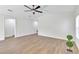 Airy living room with wood-look floors and neutral walls, ideal for any decor style at 1245 13Th St, Orange City, FL 32763