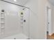 New shower featuring built-in shelves, a shower head, and crisp white walls at 1245 13Th St, Orange City, FL 32763