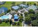 Overhead view of community amenities including a pool, tennis courts, playground and basketball court at 12826 Forestedge Cir, Orlando, FL 32828