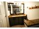 Bathroom with double vanity and granite top at 12826 Forestedge Cir, Orlando, FL 32828