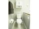 Small bathroom with toilet and wall storage at 12826 Forestedge Cir, Orlando, FL 32828