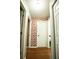 Bright hallway with decorative wallpaper and hardwood floors at 12826 Forestedge Cir, Orlando, FL 32828