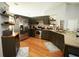 Modern kitchen with dark green cabinets, granite countertops, and stainless steel appliances at 12826 Forestedge Cir, Orlando, FL 32828