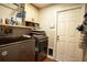 Laundry room with washer, dryer, and ample storage at 12826 Forestedge Cir, Orlando, FL 32828