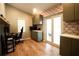Home office with built-in cabinets and wood floors at 12826 Forestedge Cir, Orlando, FL 32828