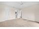 Bedroom with neutral carpet, a ceiling fan, closet, and doors leading to other rooms at 136 Carolwood Blvd, Fern Park, FL 32730