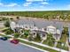 Aerial view of newly constructed townhomes in a suburban neighborhood at 16521 Prairie School Dr, Winter Garden, FL 34787