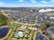 A Primary-planned community, boasting a pool, clubhouse, and beautiful homes nestled around serene lakes and green spaces at 16521 Prairie School Dr, Winter Garden, FL 34787