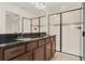 Bathroom features granite countertops, dual sinks, and updated shower at 16521 Prairie School Dr, Winter Garden, FL 34787