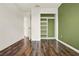 Bedroom has hardwood floors and closet with built-in shelving at 16521 Prairie School Dr, Winter Garden, FL 34787