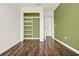 An empty bedroom features wood floors and a closet with built-in shelves at 16521 Prairie School Dr, Winter Garden, FL 34787