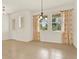 Bright and airy dining area with tile flooring, floral curtains, and natural light at 16521 Prairie School Dr, Winter Garden, FL 34787