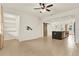 Open-concept living area with tile flooring, closet space, and views of the kitchen and stairway at 16521 Prairie School Dr, Winter Garden, FL 34787