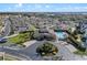 Aerial view of community clubhouse, pool, and lush landscaping creating an inviting atmosphere at 17438 Promenade Dr, Clermont, FL 34711