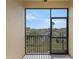 Screened balcony offers views of the community and blue skies, creating a relaxing outdoor space at 17438 Promenade Dr, Clermont, FL 34711