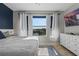 Bright bedroom with a large window view and stylish white dresser, creating a serene space at 17438 Promenade Dr, Clermont, FL 34711