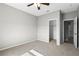 Comfortable bedroom featuring neutral carpet and a walk-in closet at 17438 Promenade Dr, Clermont, FL 34711