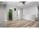 Large bedroom with wood-look flooring and multiple closets at 17438 Promenade Dr, Clermont, FL 34711