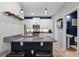 Well-lit kitchen featuring granite countertops, stainless steel appliances, and eat-in island at 17438 Promenade Dr, Clermont, FL 34711