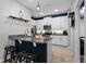 Modern kitchen with stainless steel appliances, granite countertops, and ample cabinet space at 17438 Promenade Dr, Clermont, FL 34711